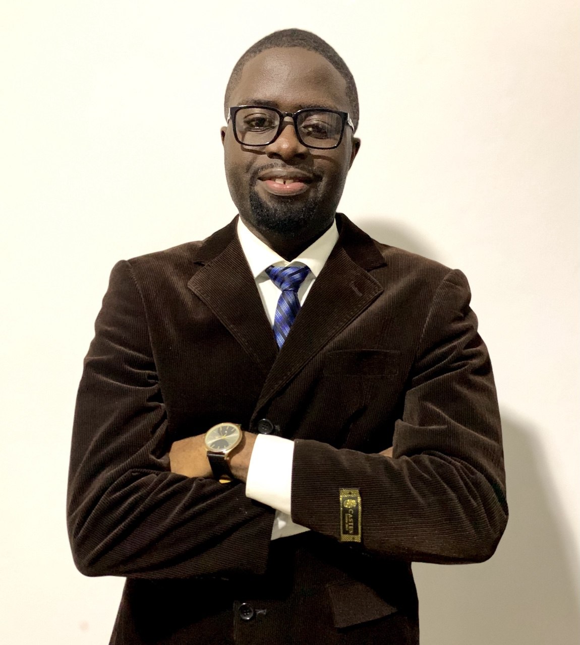 Instructor guiding engineering students through hands-on product development process in classroom