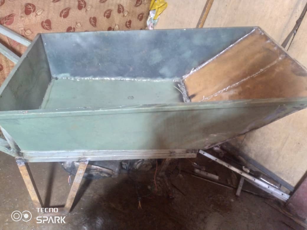 Detailed view of the wheelbarrow frame structure and welding